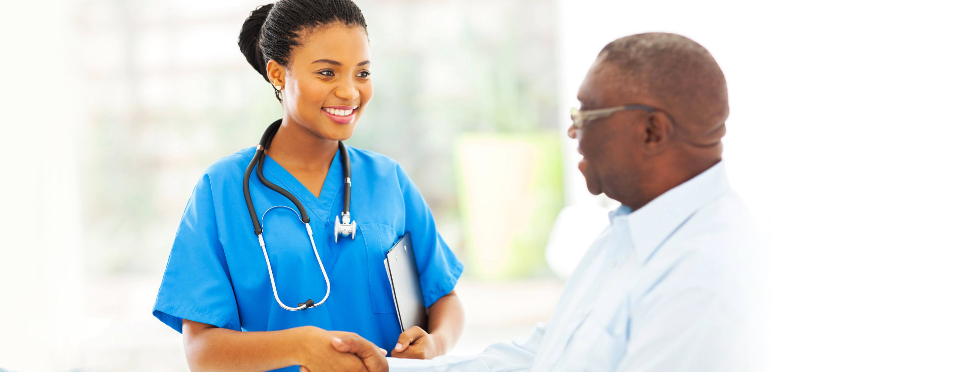 female nurse and adult man smiling