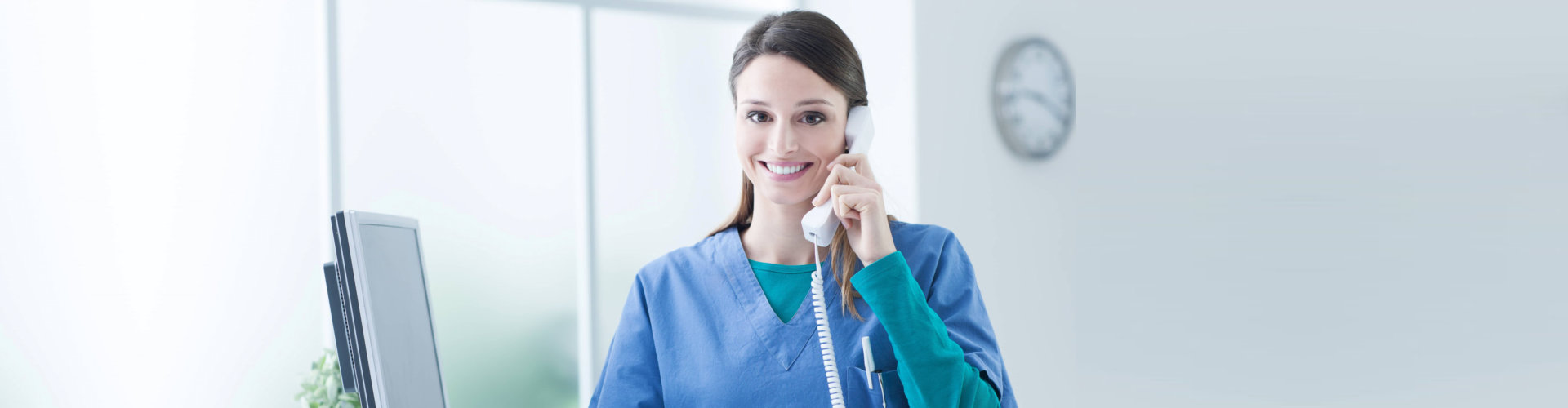 young female nurse answering phone calls